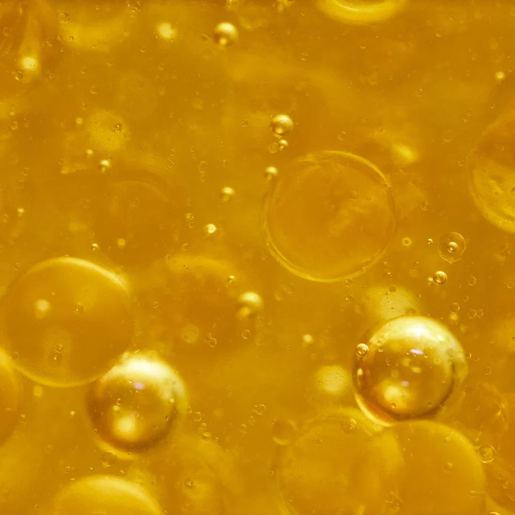 Close-up of yellow liquid with bubbles