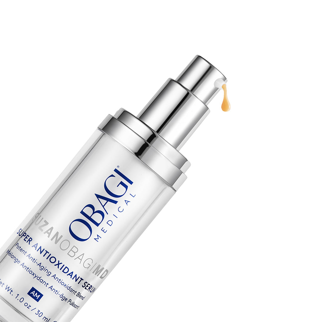 A clear cylindrical pump bottle of Obagi Medical Super Antioxidant Serum with a reflective silver pump, shown on a clean white background with a small amber droplet dripping from the top.