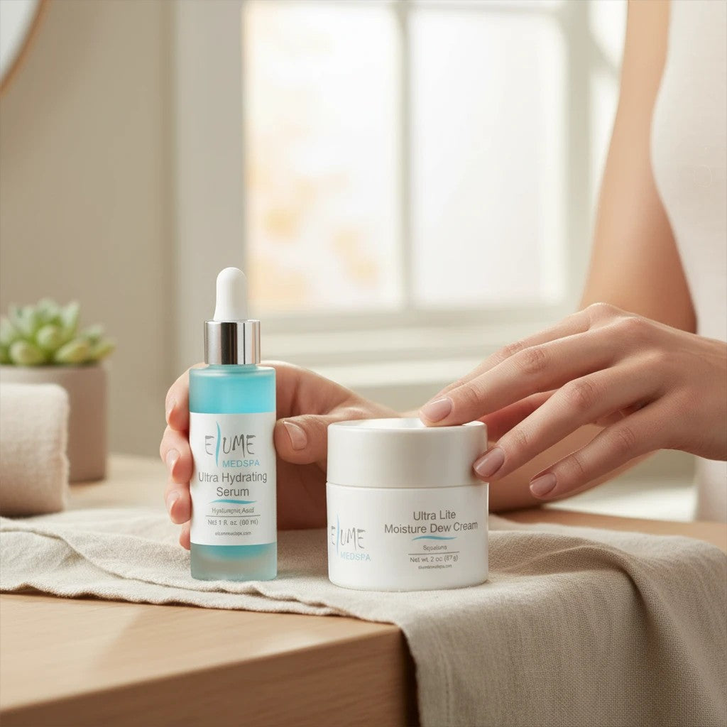 Elume Medspa Ultra Hydrating Bundle featuring a blue hyaluronic acid serum and a white moisture dew cream jar.