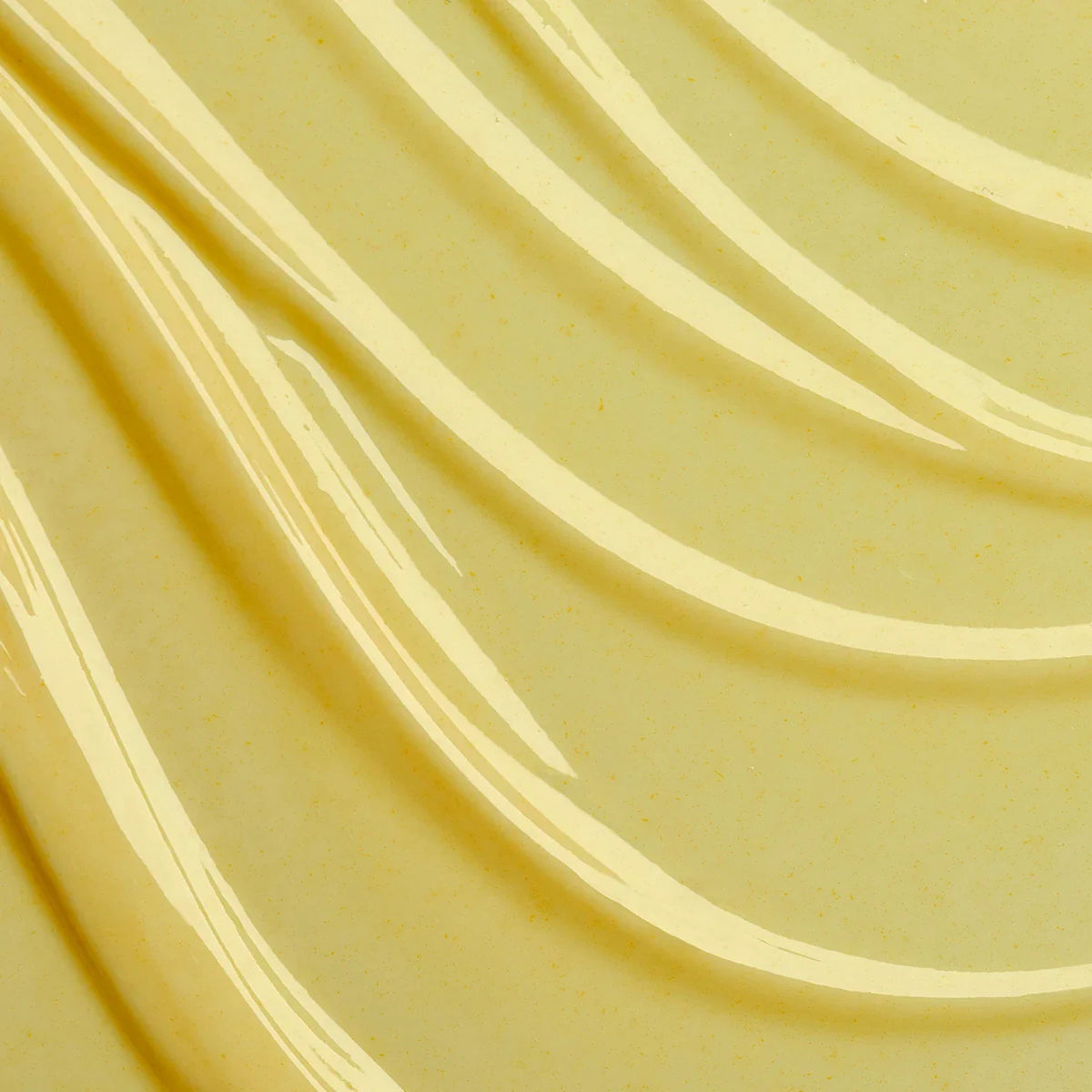 Close-up of smooth, beige-colored fabric with wavy patterns
