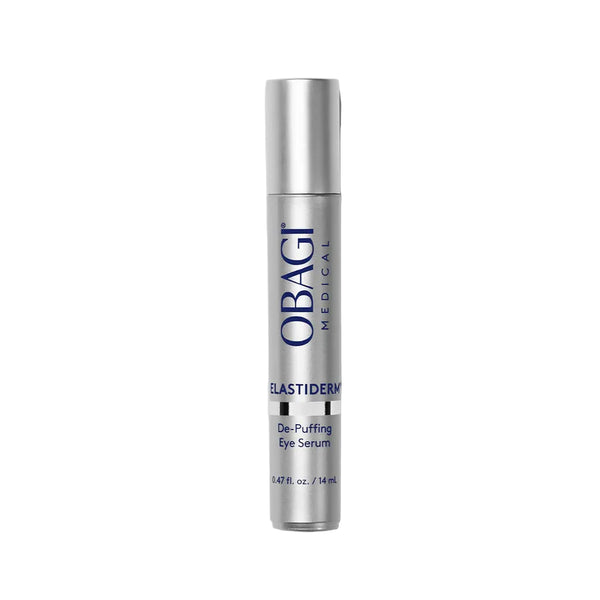 A silver cylindrical bottle of OBAGI MEDICAL Elastiderm De-Puffing Eye Serum, standing vertically against a solid light gray background.