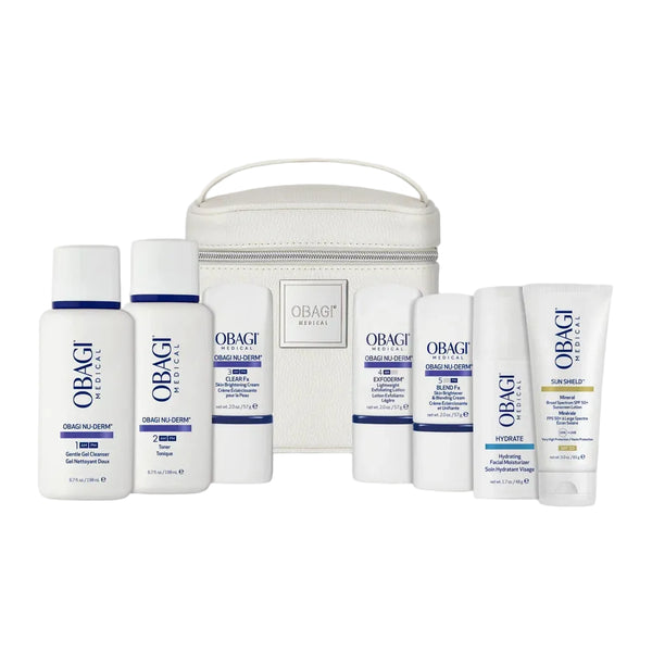 Obagi skincare products with a white travel bag on a light gray background